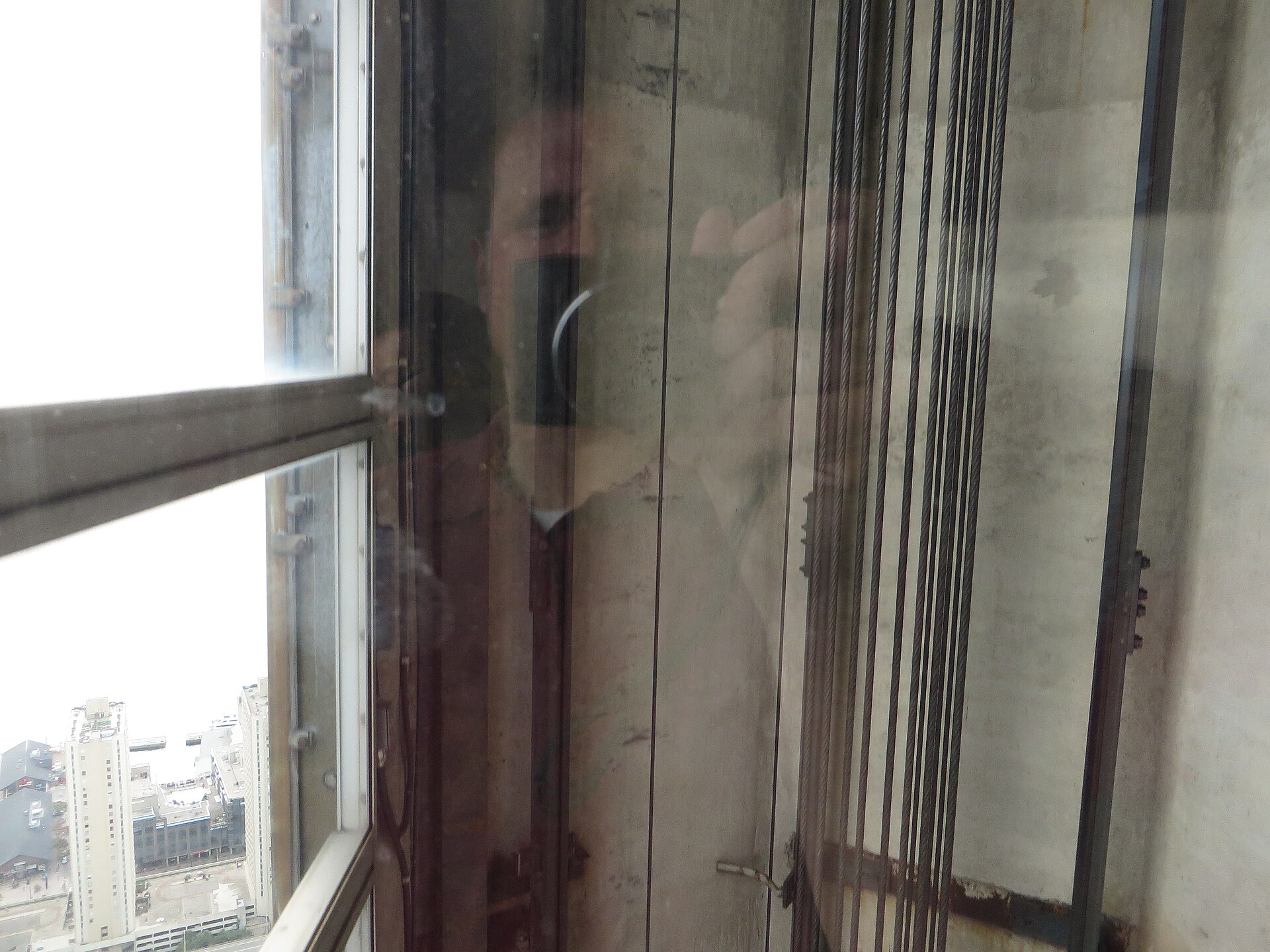 Interior of a passenger lift car on the way up a tall observation tower